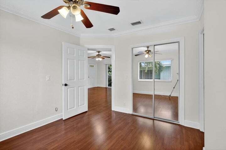 45 Southeast 7th Avenue, Unit 6 Delray Beach, FL 33483 - Photo 15 of 19 a view of an empty room with wooden floor and a window