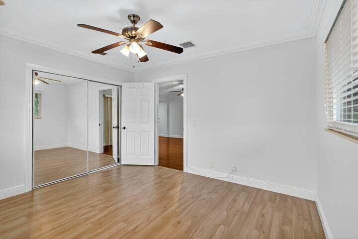 45 Southeast 7th Avenue, Unit 6 Delray Beach, FL 33483 - Photo 16 of 19 a view of an empty room with wooden floor and a window
