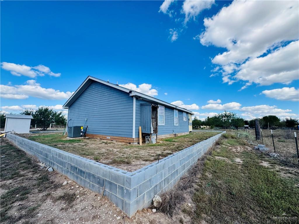 22417 Carrizales Road, Unit SERVICE Edinburg, TX 78542 - Photo 19 of 28 a view of an house with backyard space and balcony
