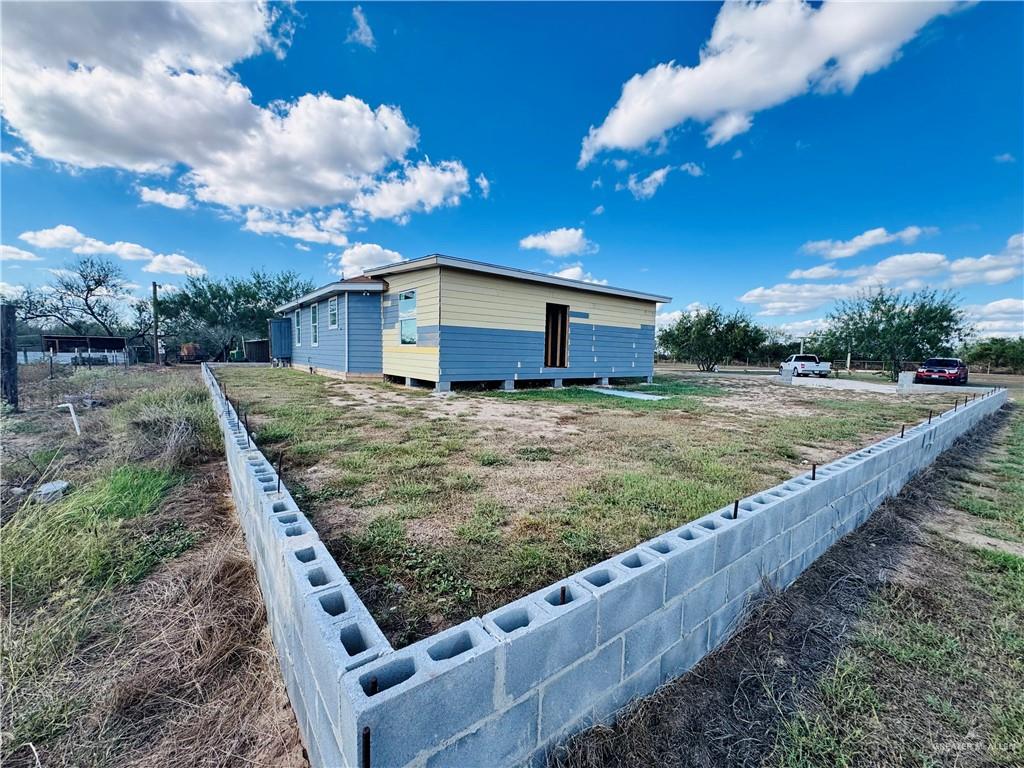 22417 Carrizales Road, Unit SERVICE Edinburg, TX 78542 - Photo 20 of 28 a view of a backyard with a house