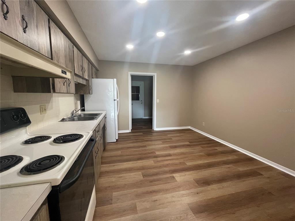 1350 South Alto Verde Terrace, Unit A Inverness, FL 34452 - Photo 11 of 14 a kitchen with a sink and cabinets