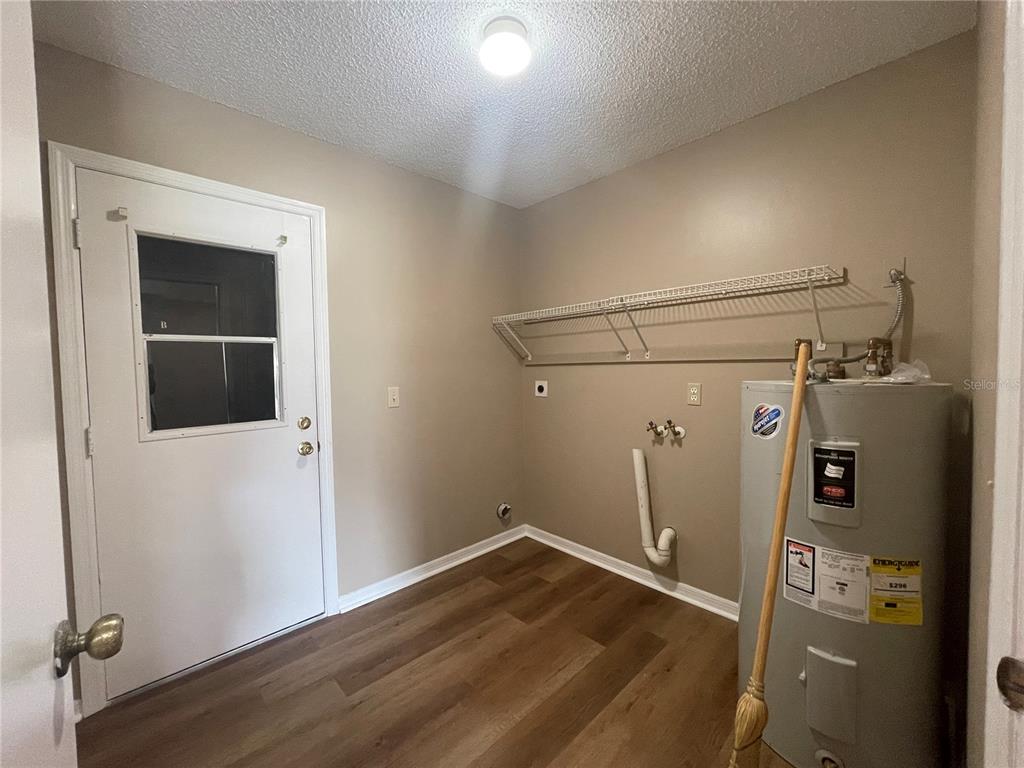 1350 South Alto Verde Terrace, Unit A Inverness, FL 34452 - Photo 13 of 14 a view of a room with wooden floor and windows