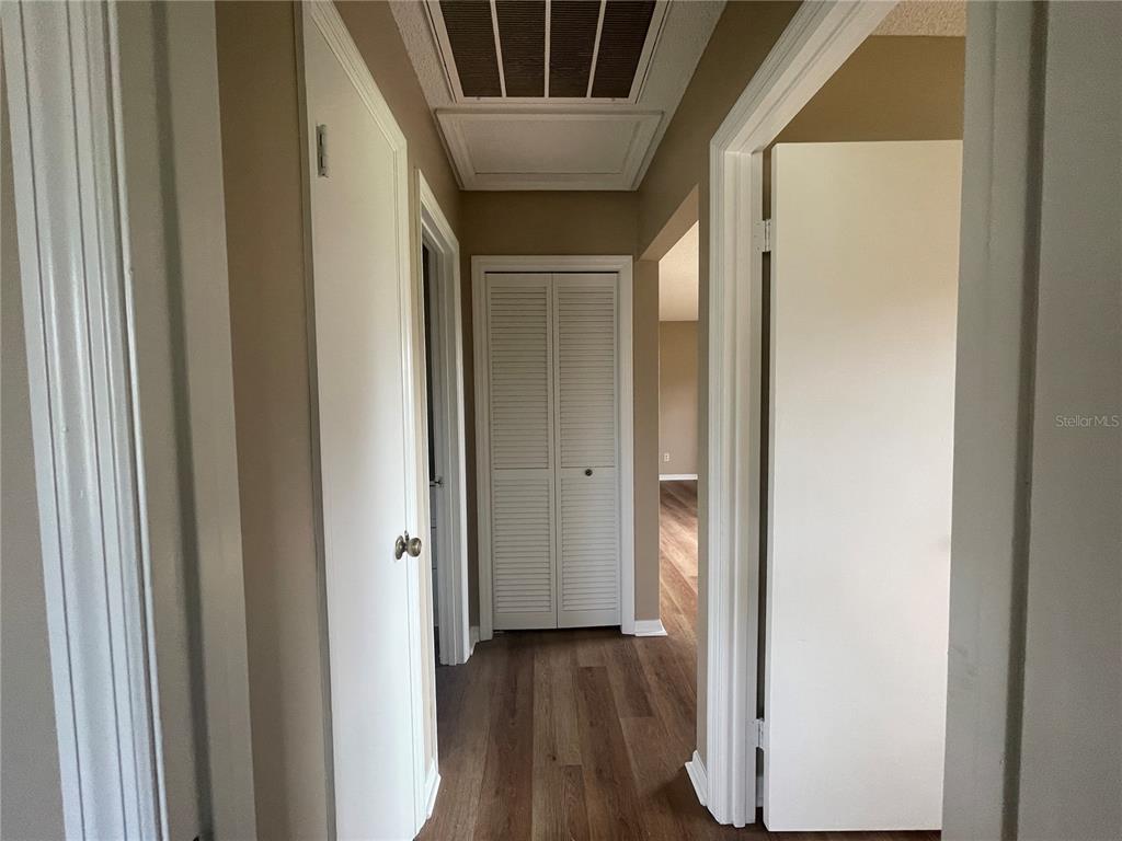 1350 South Alto Verde Terrace, Unit A Inverness, FL 34452 - Photo 9 of 14 a view of a hallway with wooden floor