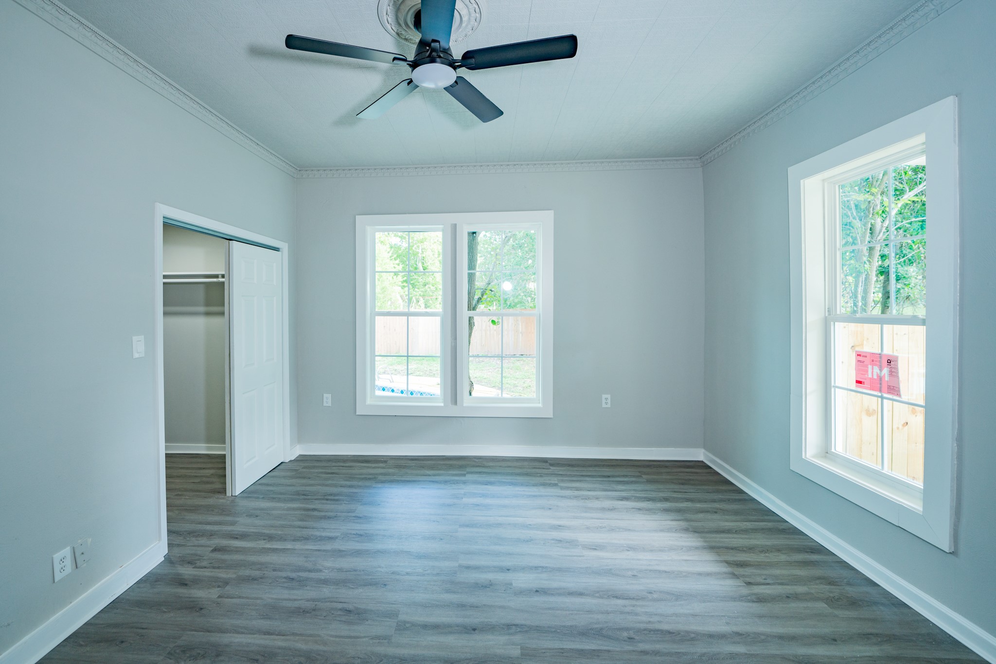 2145 16th Street Hempstead, TX 77445 - Photo 15 of 43 a view of empty room with wooden floor and fan