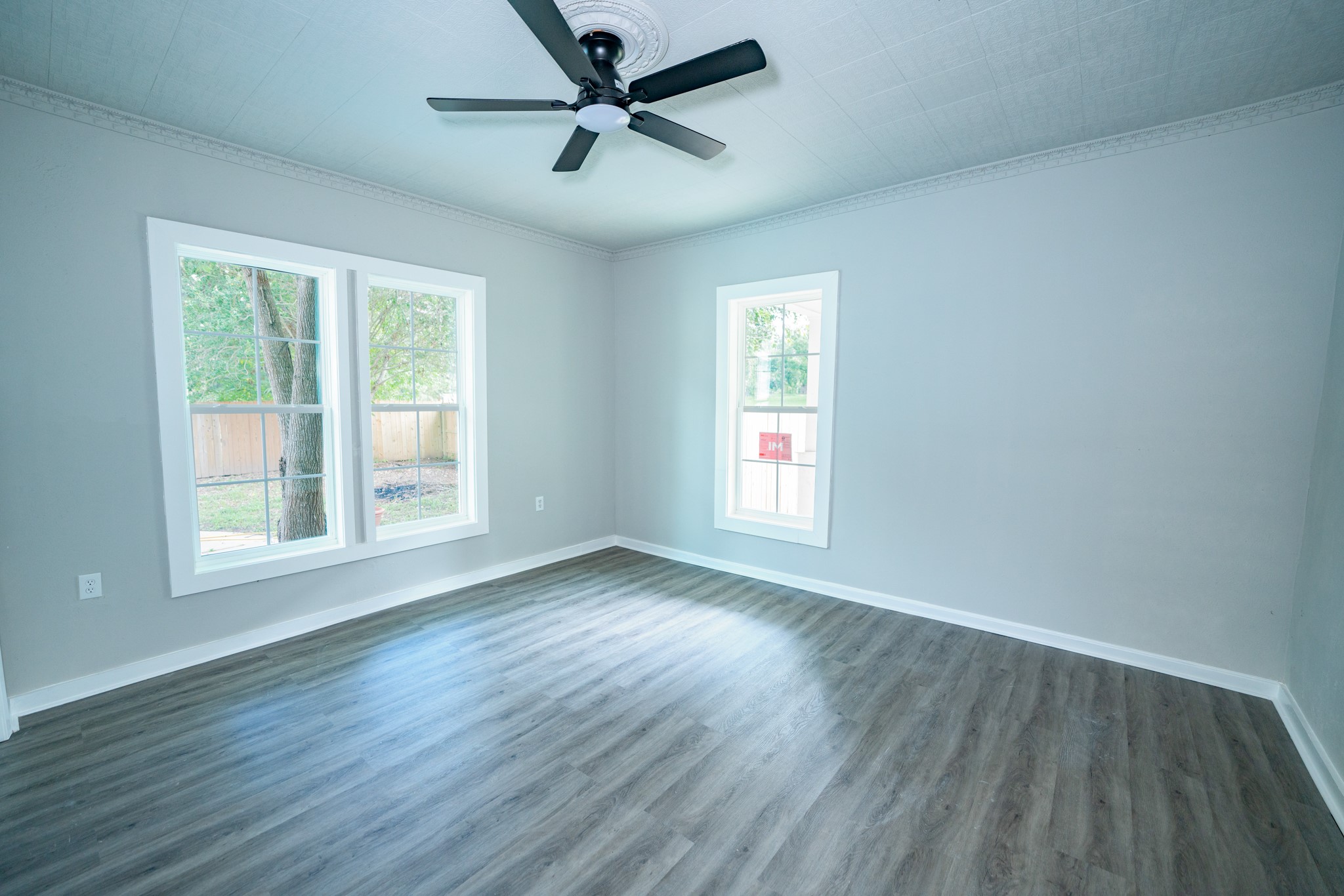 2145 16th Street Hempstead, TX 77445 - Photo 17 of 43 a view of empty room with wooden floor and fan