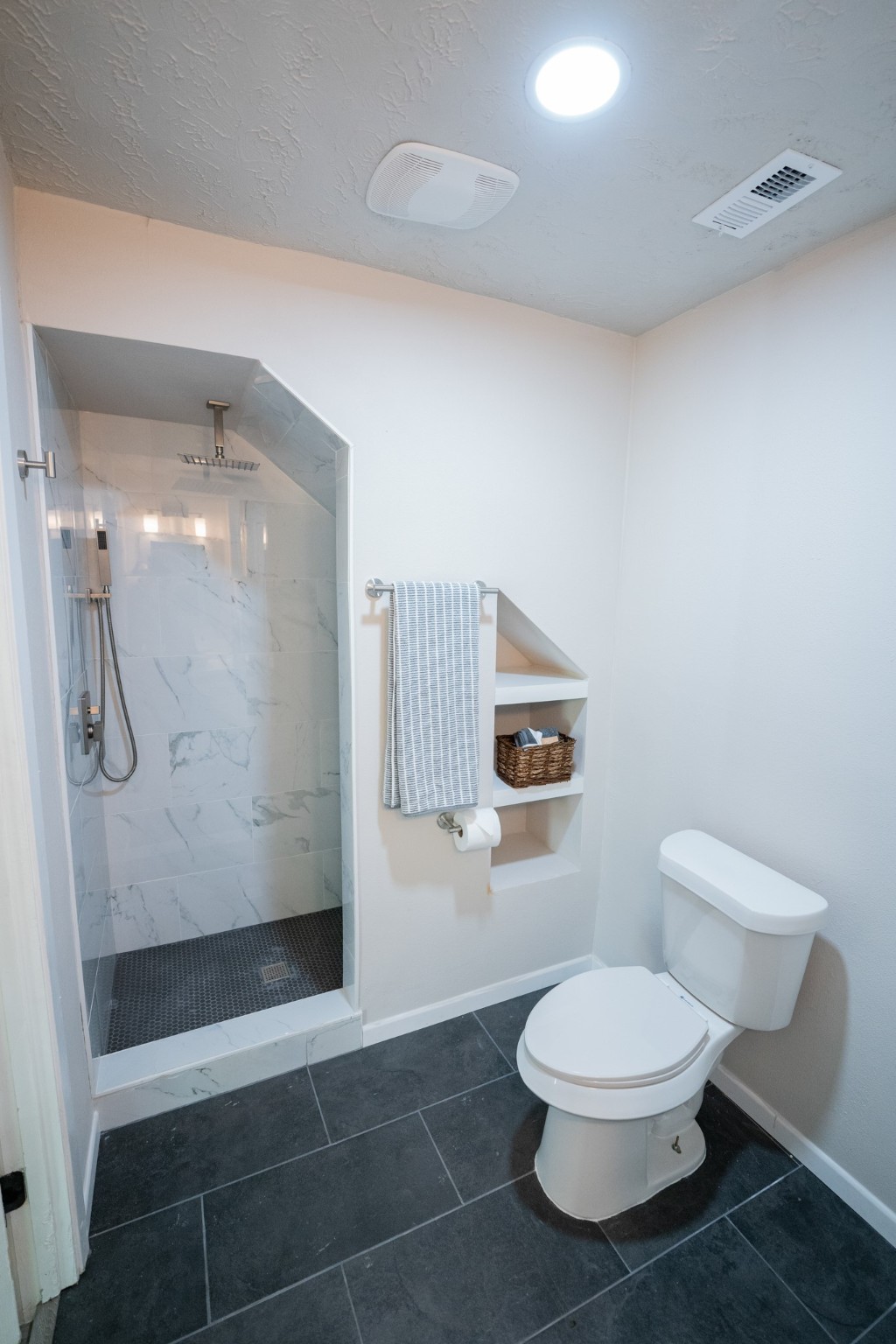 2145 16th Street Hempstead, TX 77445 - Photo 21 of 43 a bathroom with a toilet and a shower