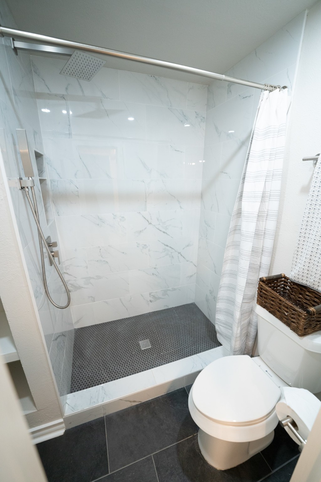 2145 16th Street Hempstead, TX 77445 - Photo 25 of 43 a bathroom with a toilet and a shower