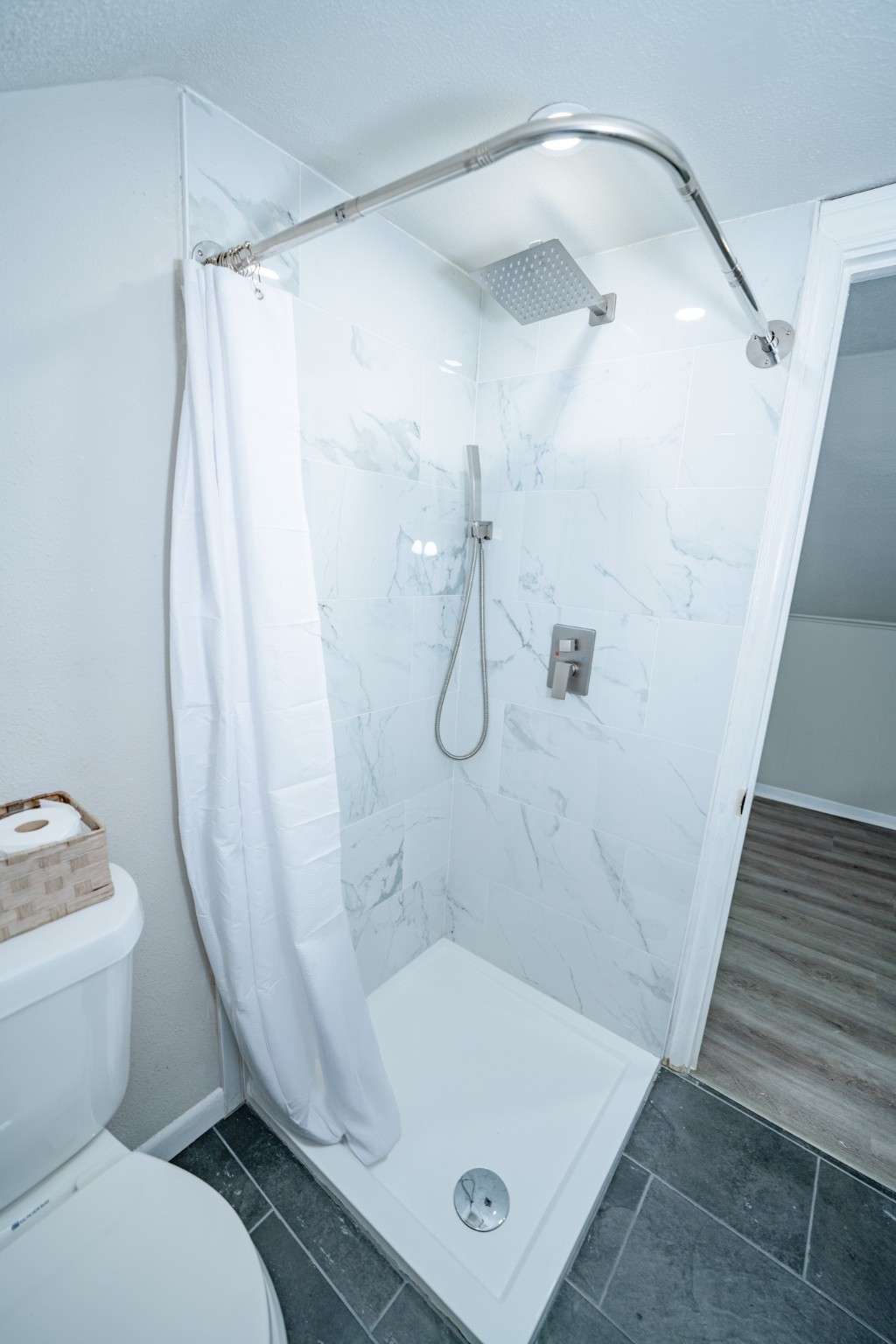 2145 16th Street Hempstead, TX 77445 - Photo 27 of 43 a bathroom with a sink a toilet and shower