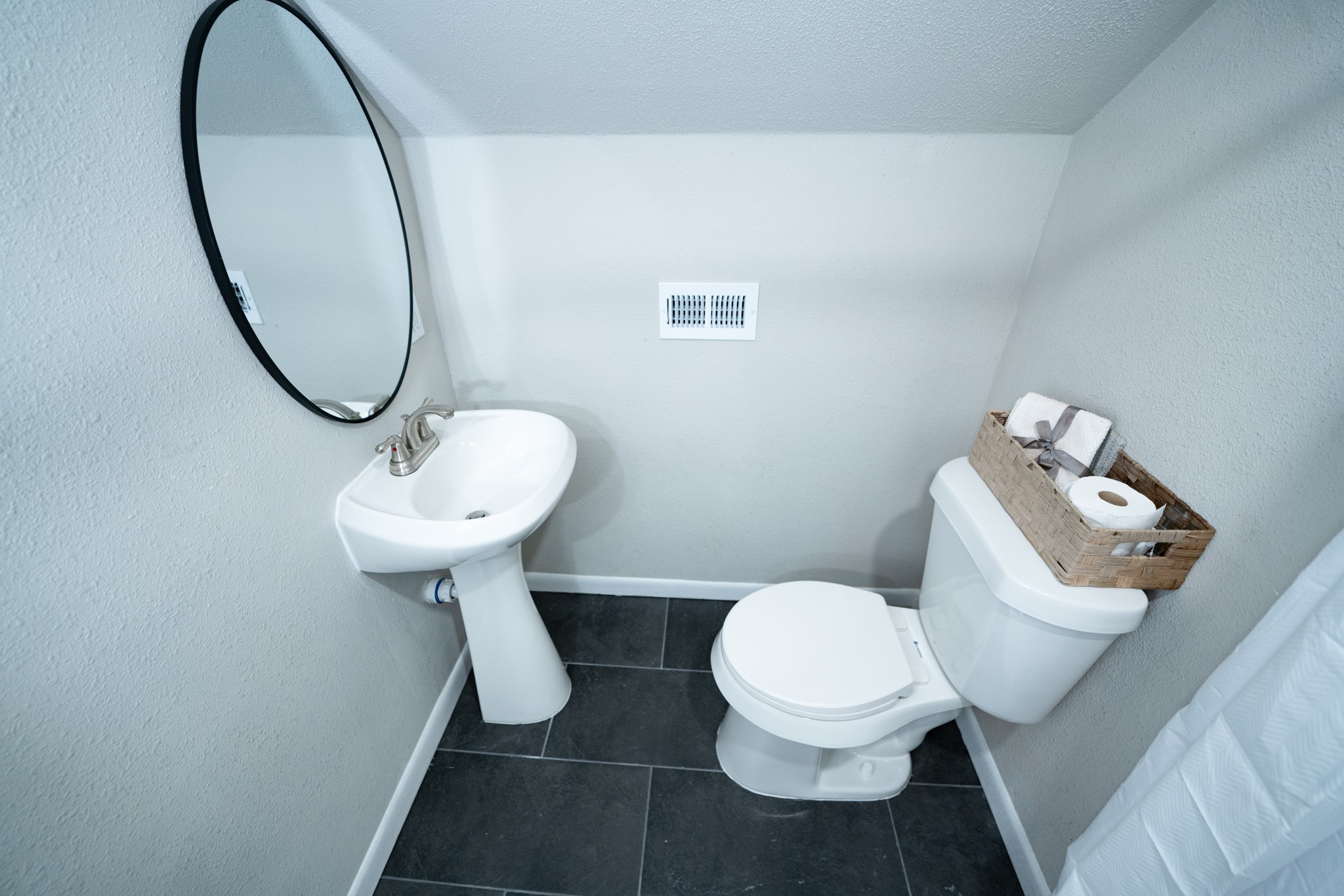 2145 16th Street Hempstead, TX 77445 - Photo 28 of 43 a bathroom with a toilet sink and mirror