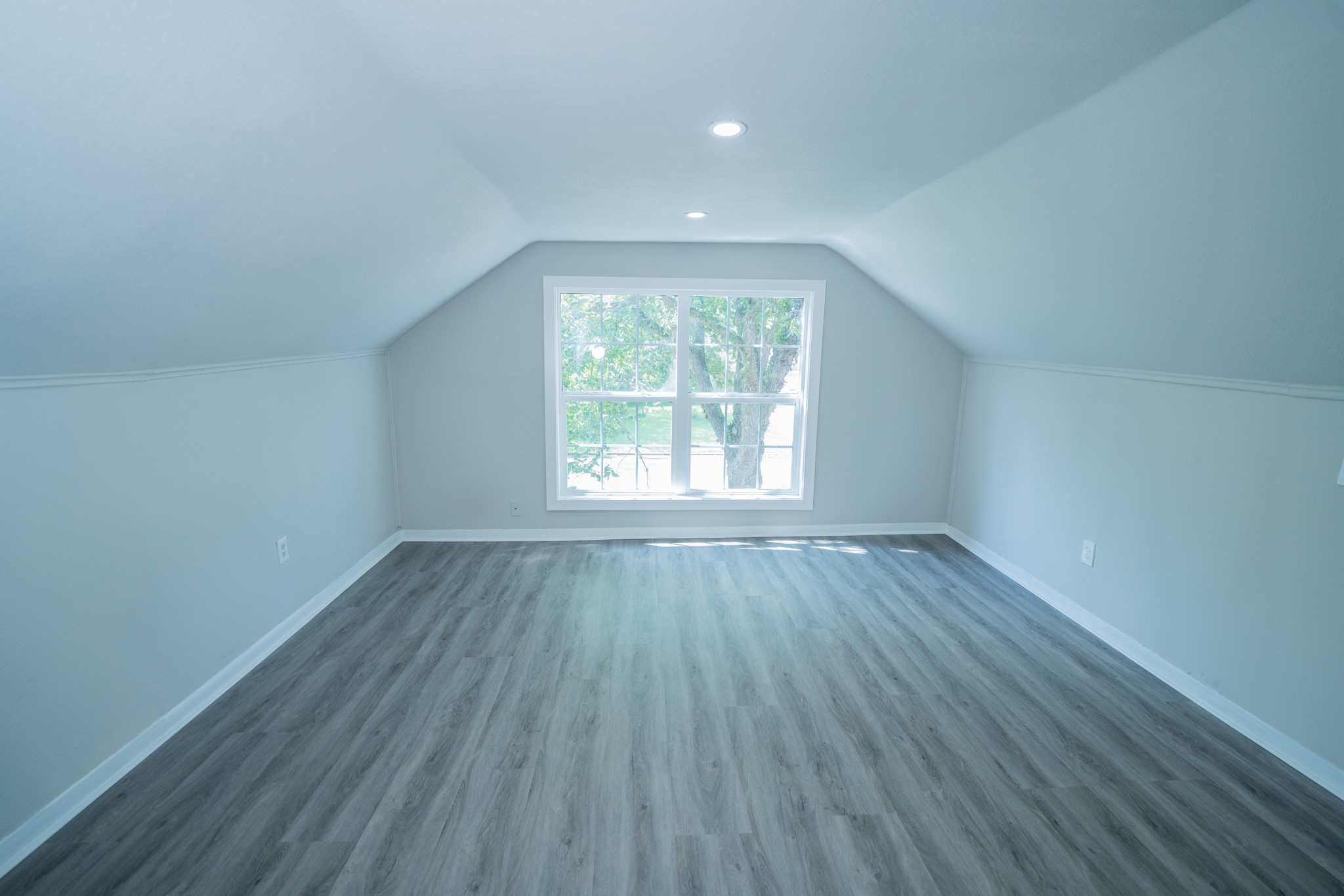2145 16th Street Hempstead, TX 77445 - Photo 31 of 43 an empty room with wooden floor and windows