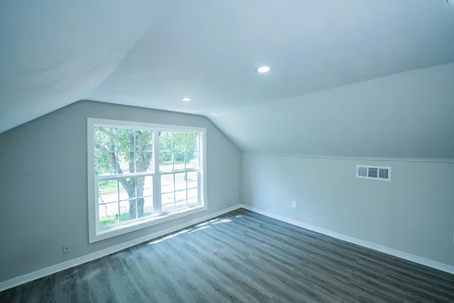 a bathroom with a sink toilet and a mirror