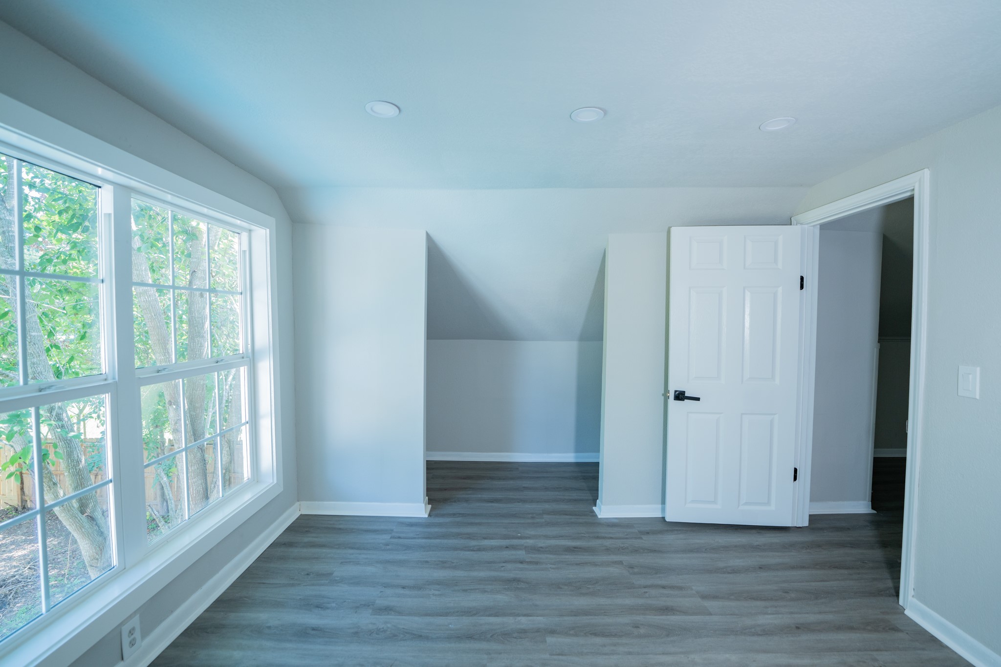 2145 16th Street Hempstead, TX 77445 - Photo 37 of 43 a view of an empty room with wooden floor and a window