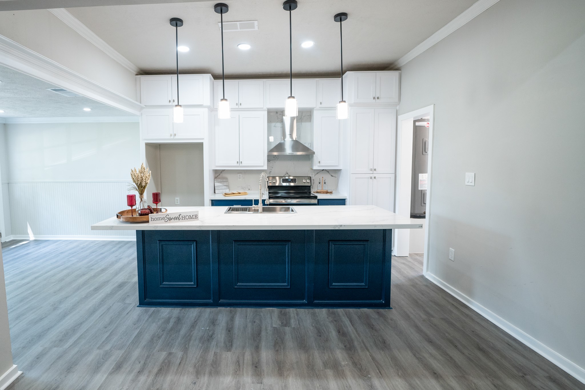 2145 16th Street Hempstead, TX 77445 - Photo 9 of 43 a kitchen with stainless steel appliances granite countertop a sink cabinets and wooden floor