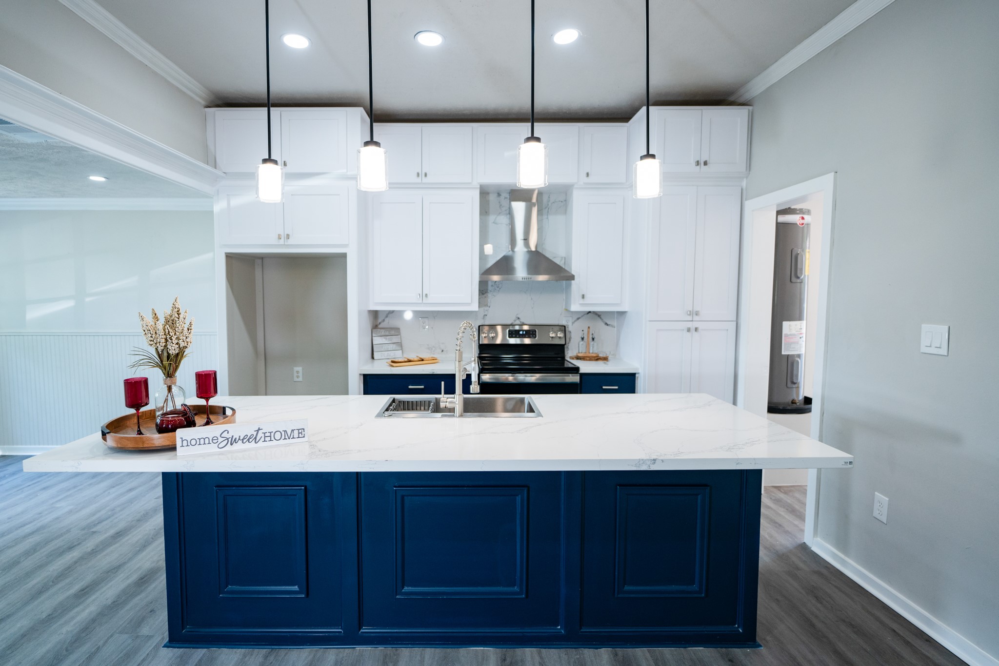 2145 16th Street Hempstead, TX 77445 - Photo 10 of 43 a large kitchen with stainless steel appliances kitchen island granite countertop a sink refrigerator and cabinets