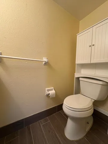 a bathroom with a toilet and a sink