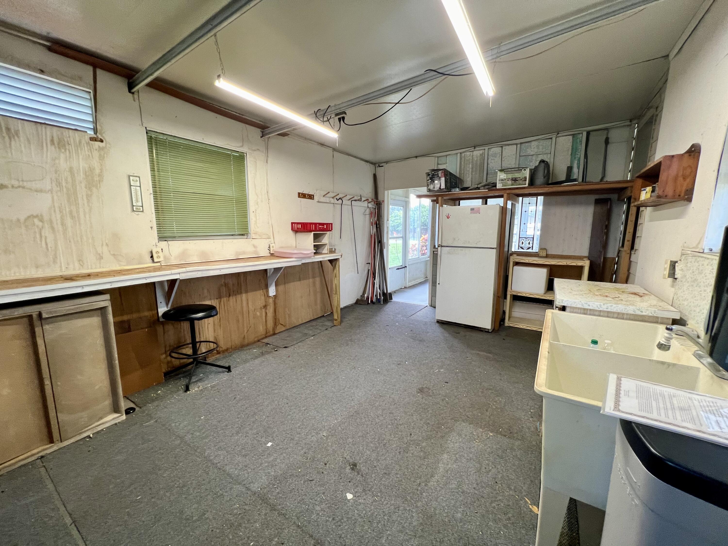 1303 Jordan Loop Okeechobee, FL 34974 - Photo 12 of 33 a storage room with washer and dryer