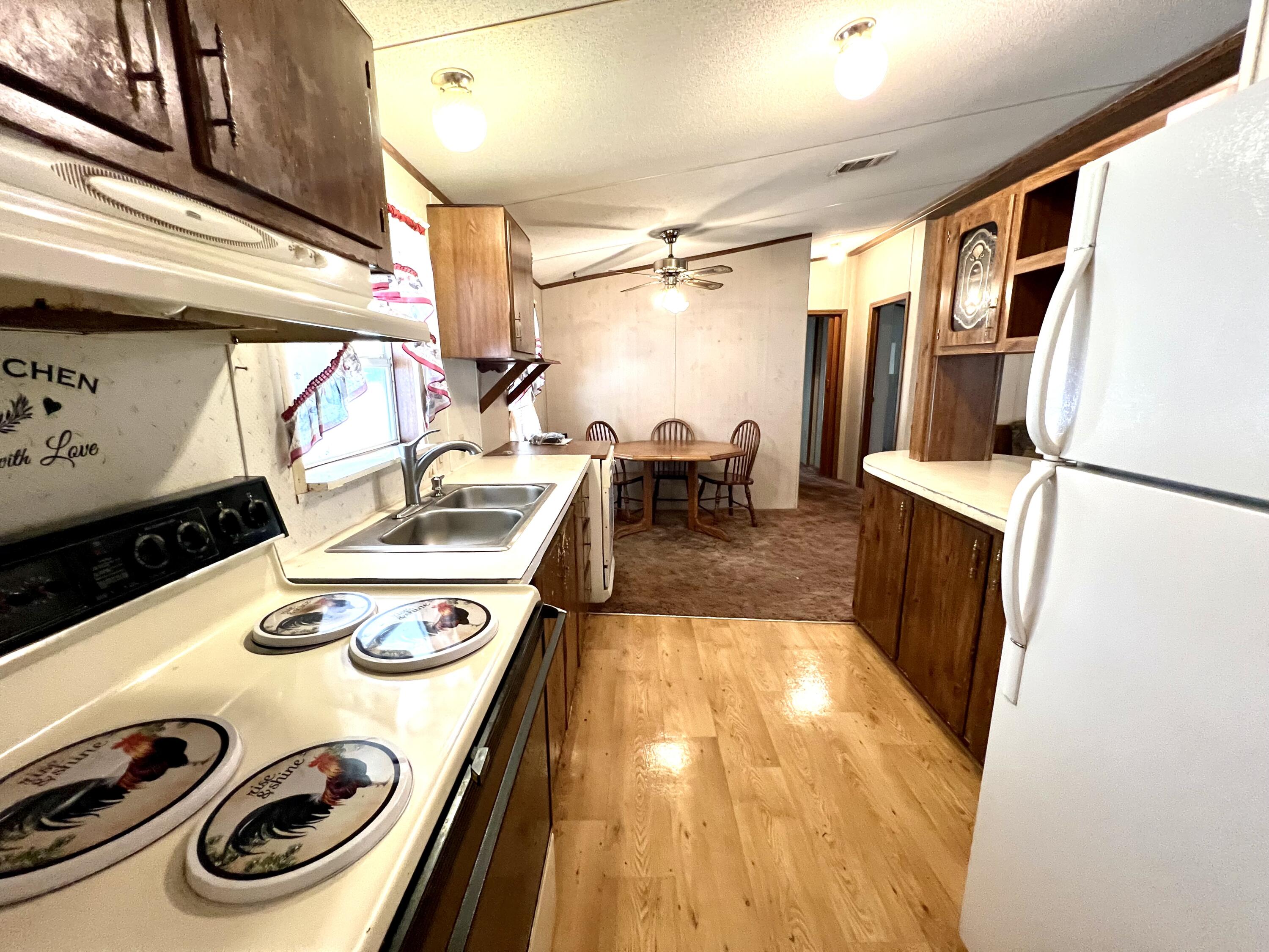 1303 Jordan Loop Okeechobee, FL 34974 - Photo 20 of 33 a kitchen with a appliances and cabinets