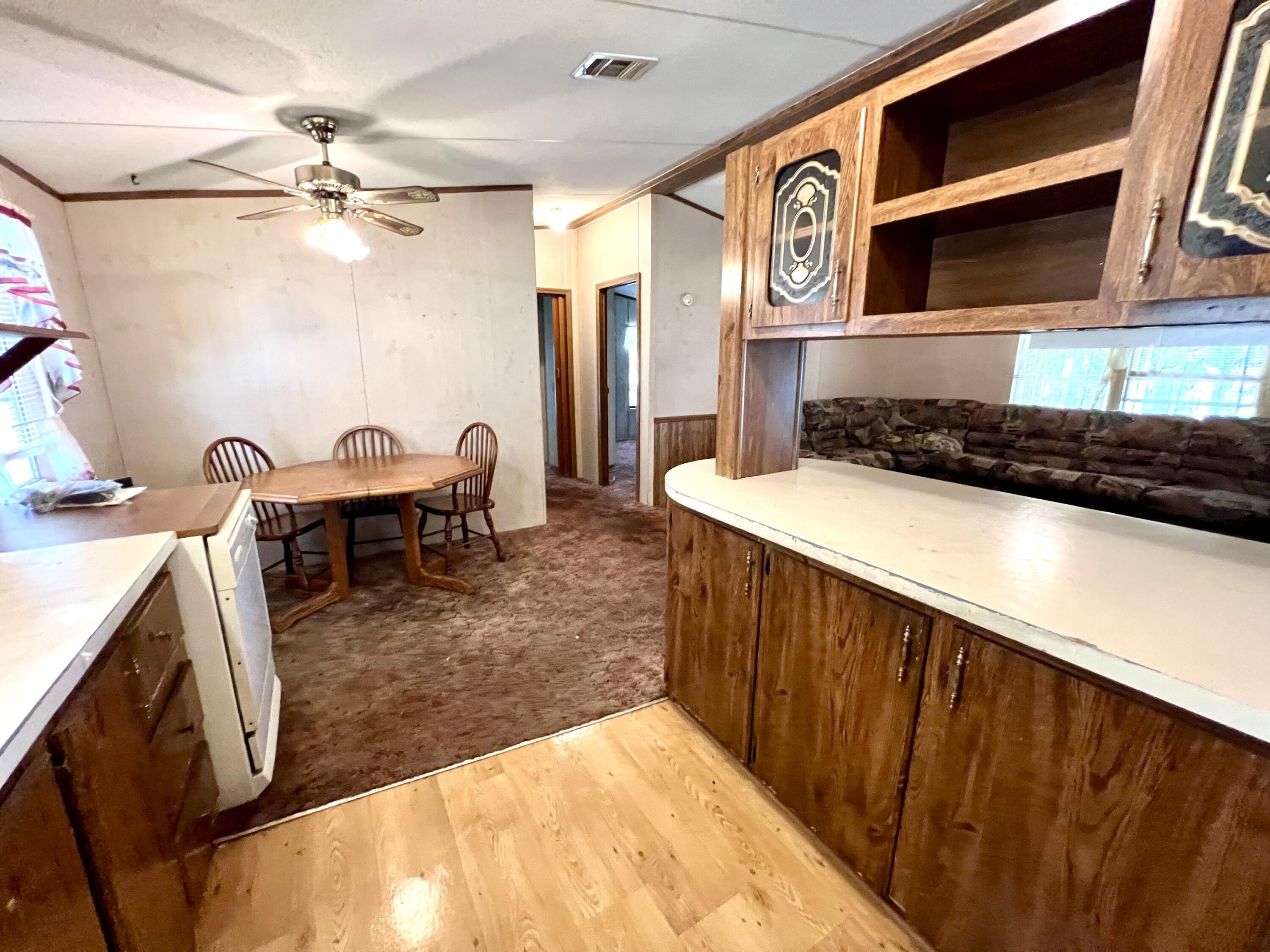 1303 Jordan Loop Okeechobee, FL 34974 - Photo 21 of 33 a kitchen with a sink and a stove top oven
