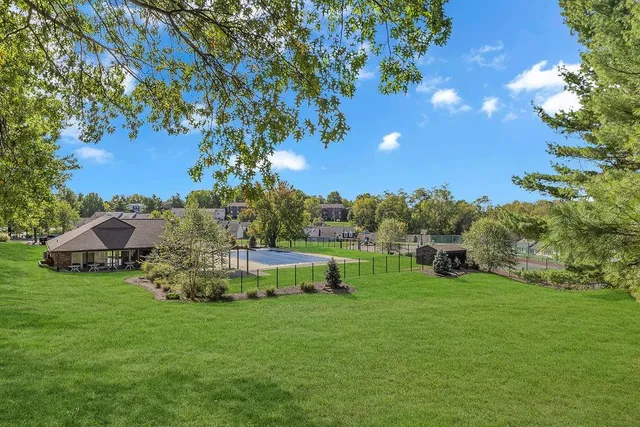 a view of a garden with a building in the background