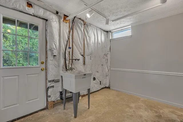 a bathroom with a shower and a sink