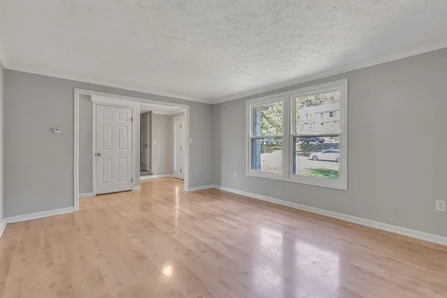 a view of an empty room with a window