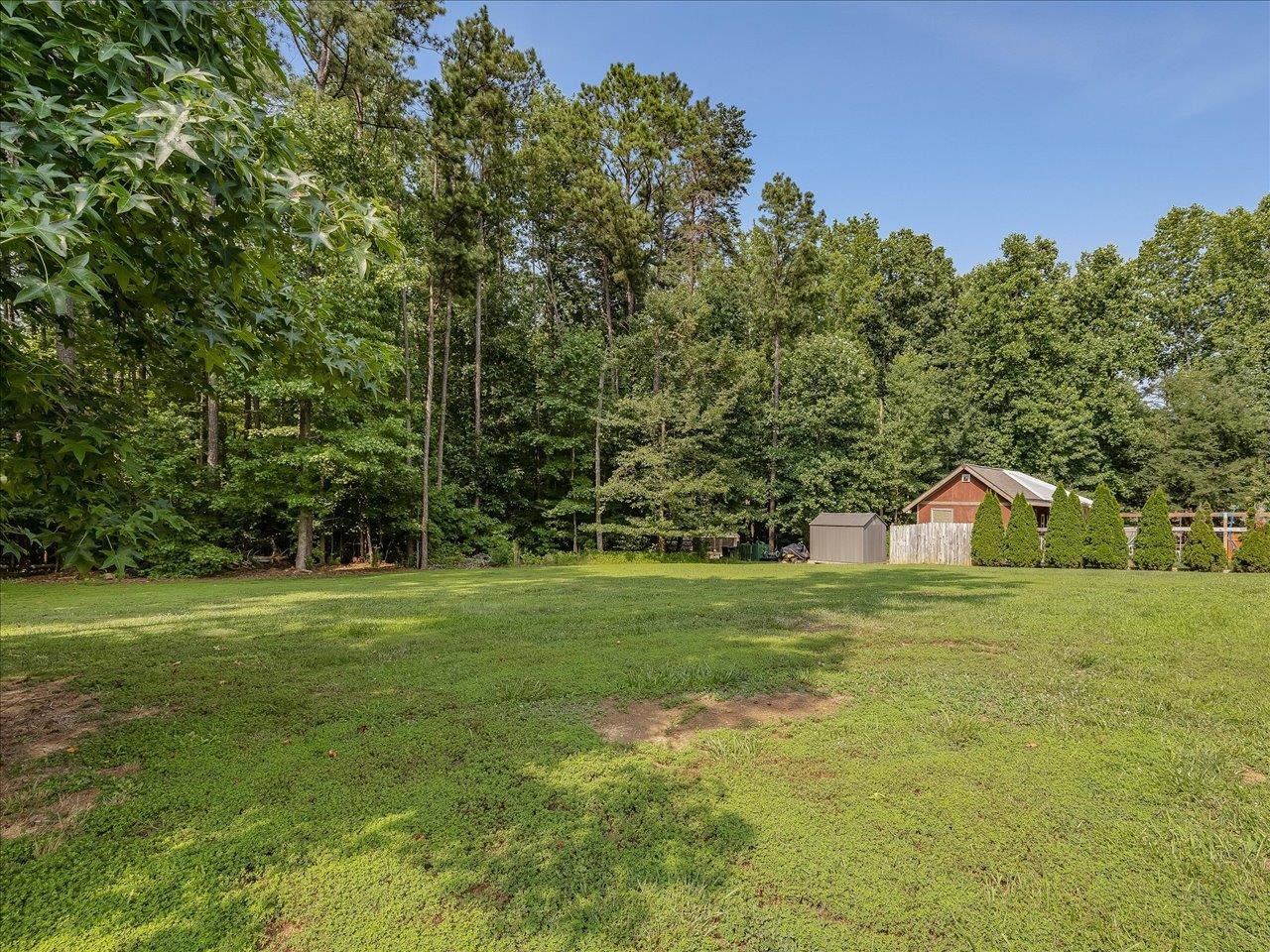 258 Punch Hill Farm Road Rougemont, NC 27572 - Photo 54 of 58 a front view of a house with a yard