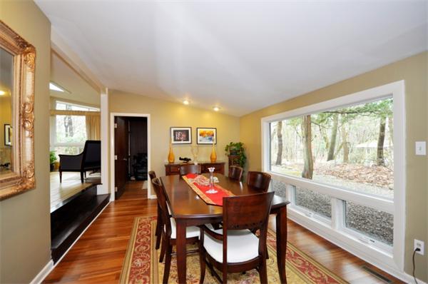 2 Partridge Road Lexington, MA 02420 - Photo 4 of 17 a dining room with furniture and a floor to ceiling window