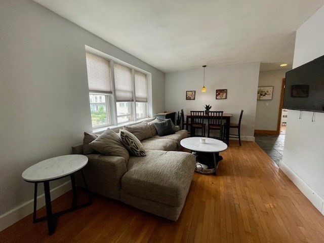 125 Farragut Road, Unit 46 Boston, MA 02127 - Photo 7 of 15 a living room with furniture and a large window