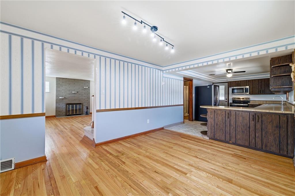 5626 5th Street Pittsburgh, PA 15236 - Photo 12 of 38 a large room with wooden floor and windows