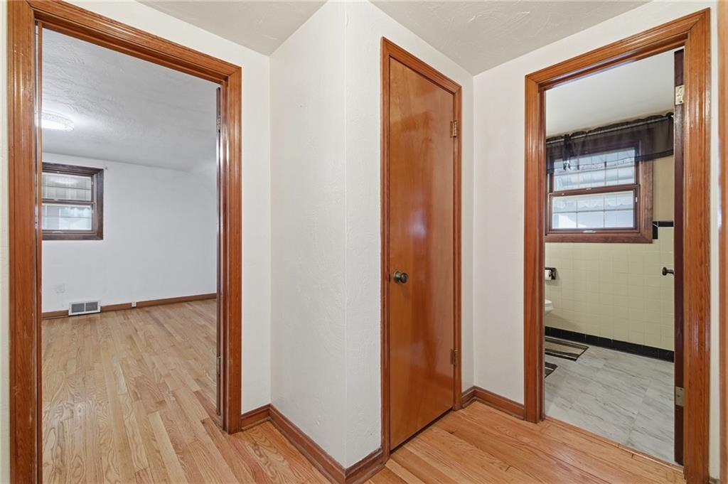 5626 5th Street Pittsburgh, PA 15236 - Photo 15 of 38 a view of hallway with wooden floor