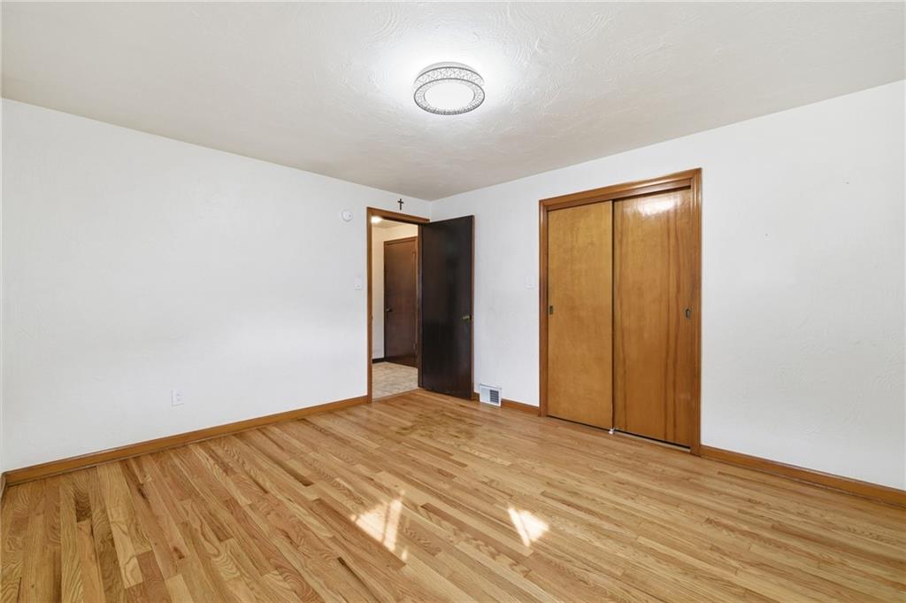 5626 5th Street Pittsburgh, PA 15236 - Photo 16 of 38 a view of empty room with wooden floor