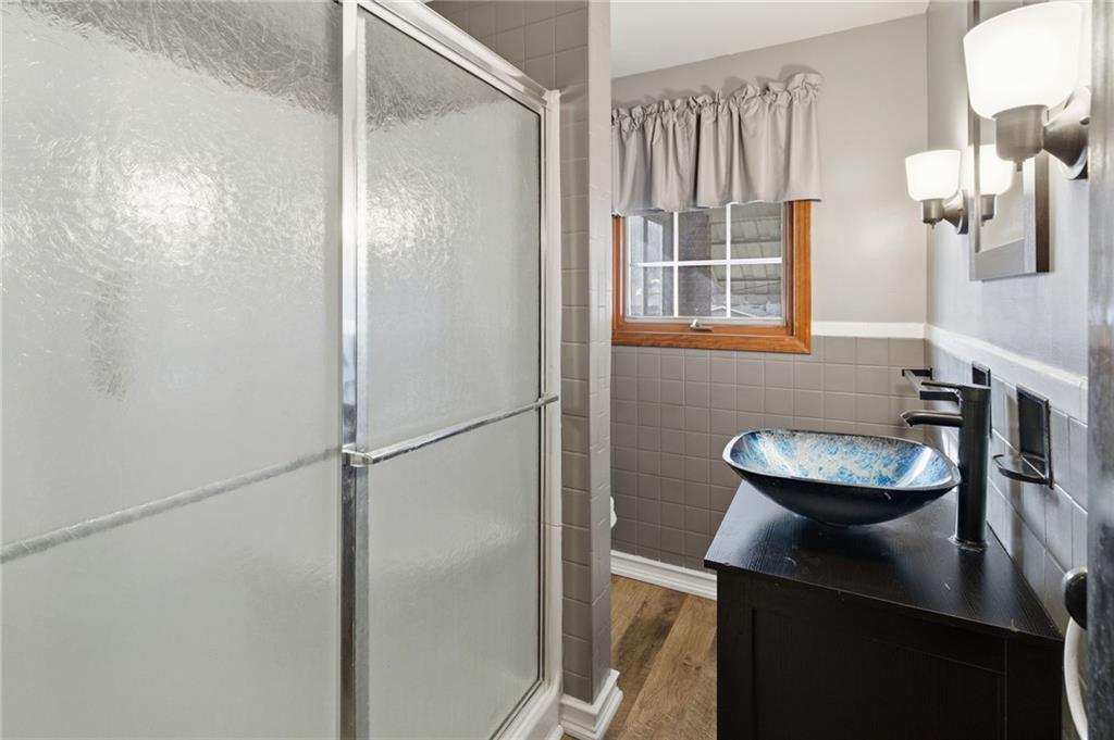 5626 5th Street Pittsburgh, PA 15236 - Photo 20 of 38 a bathroom with a sink and a mirror