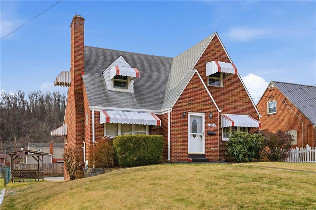 5626 5th Street Pittsburgh, PA 15236 - Photo 2 of 38 a front view of a house with a yard