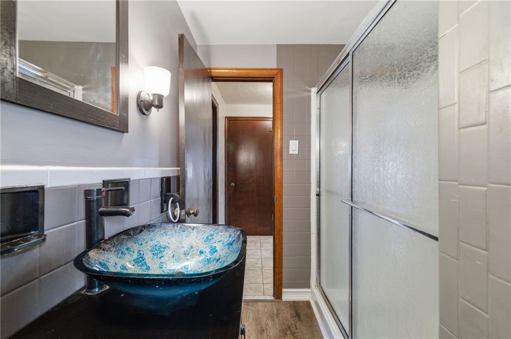 5626 5th Street Pittsburgh, PA 15236 - Photo 21 of 38 a view of a hallway with dining area and glass doors