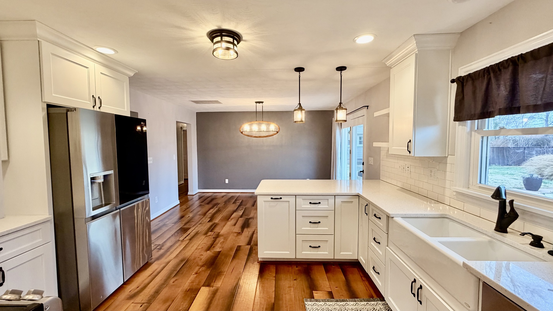 1931 West 4th Street Centralia, IL 62801 - Photo 5 of 15 a kitchen with stainless steel appliances a refrigerator sink and wooden floor