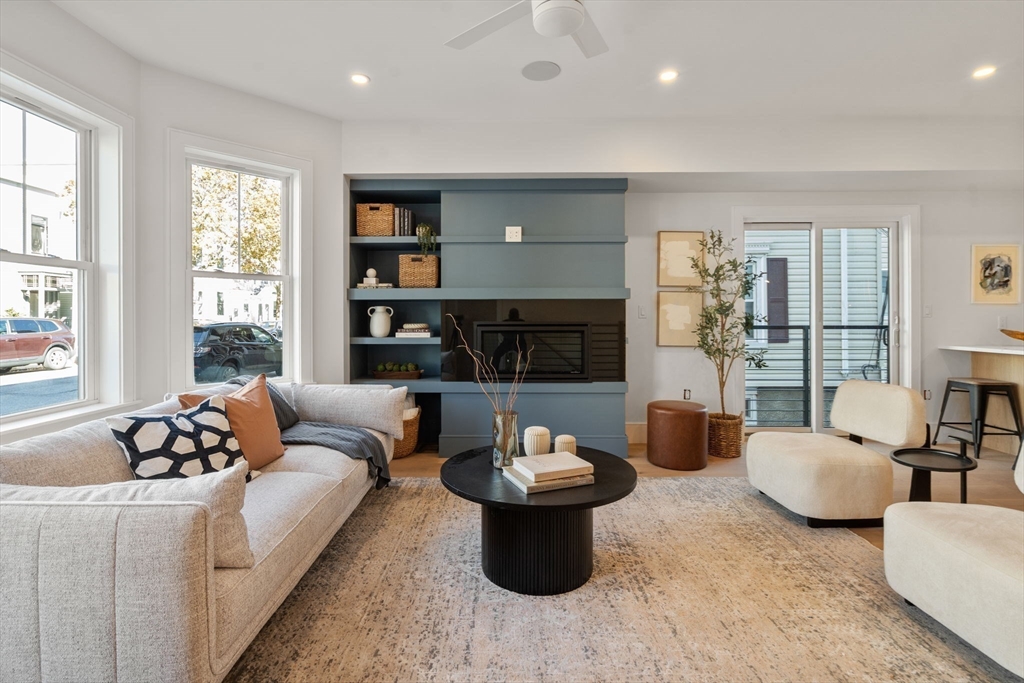 527 East 7th Street, Unit 1 Boston, MA 02127 - Photo 1 of 24 a living room with furniture and a large window