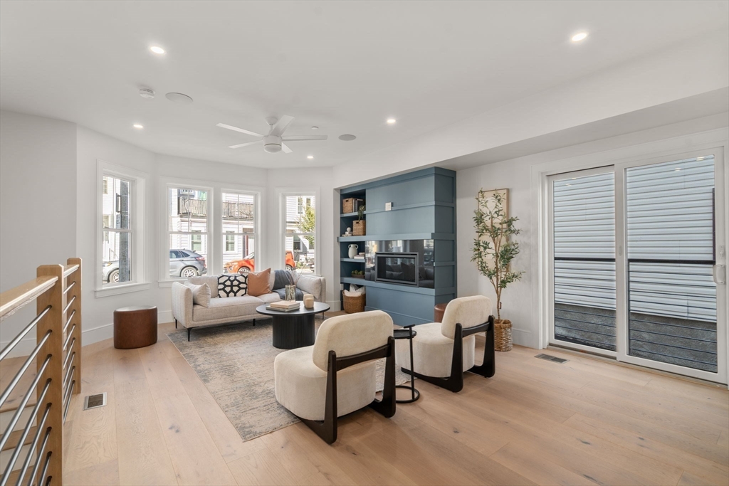 527 East 7th Street, Unit 1 Boston, MA 02127 - Photo 3 of 24 a living room with furniture and a large window