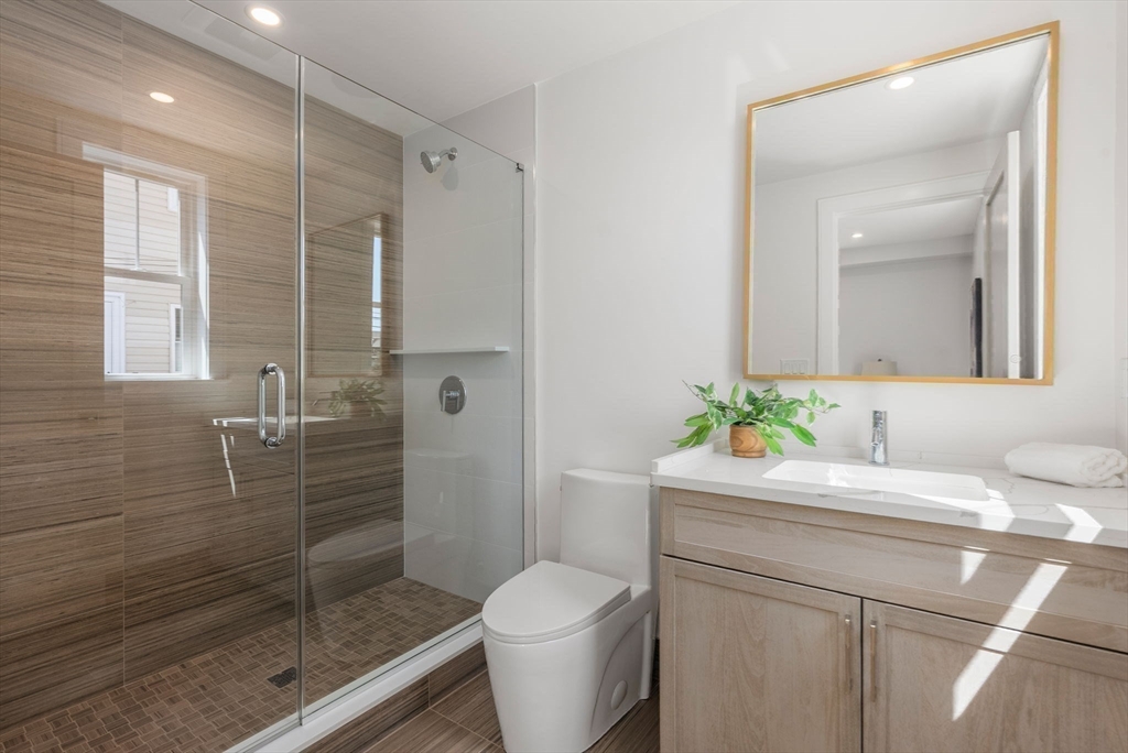 527 East 7th Street, Unit 1 Boston, MA 02127 - Photo 9 of 24 a bathroom with a sink toilet and shower