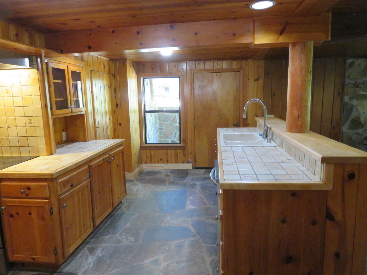 2563 Woodhouse Mine Road West Point, CA 95255 - Photo 34 of 49 a bathroom with a granite countertop sink a large mirror and a shower