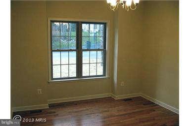 6721 Ridgecrest Road New Market, MD 21774 - Photo 3 of 17 an empty room with wooden floor and windows