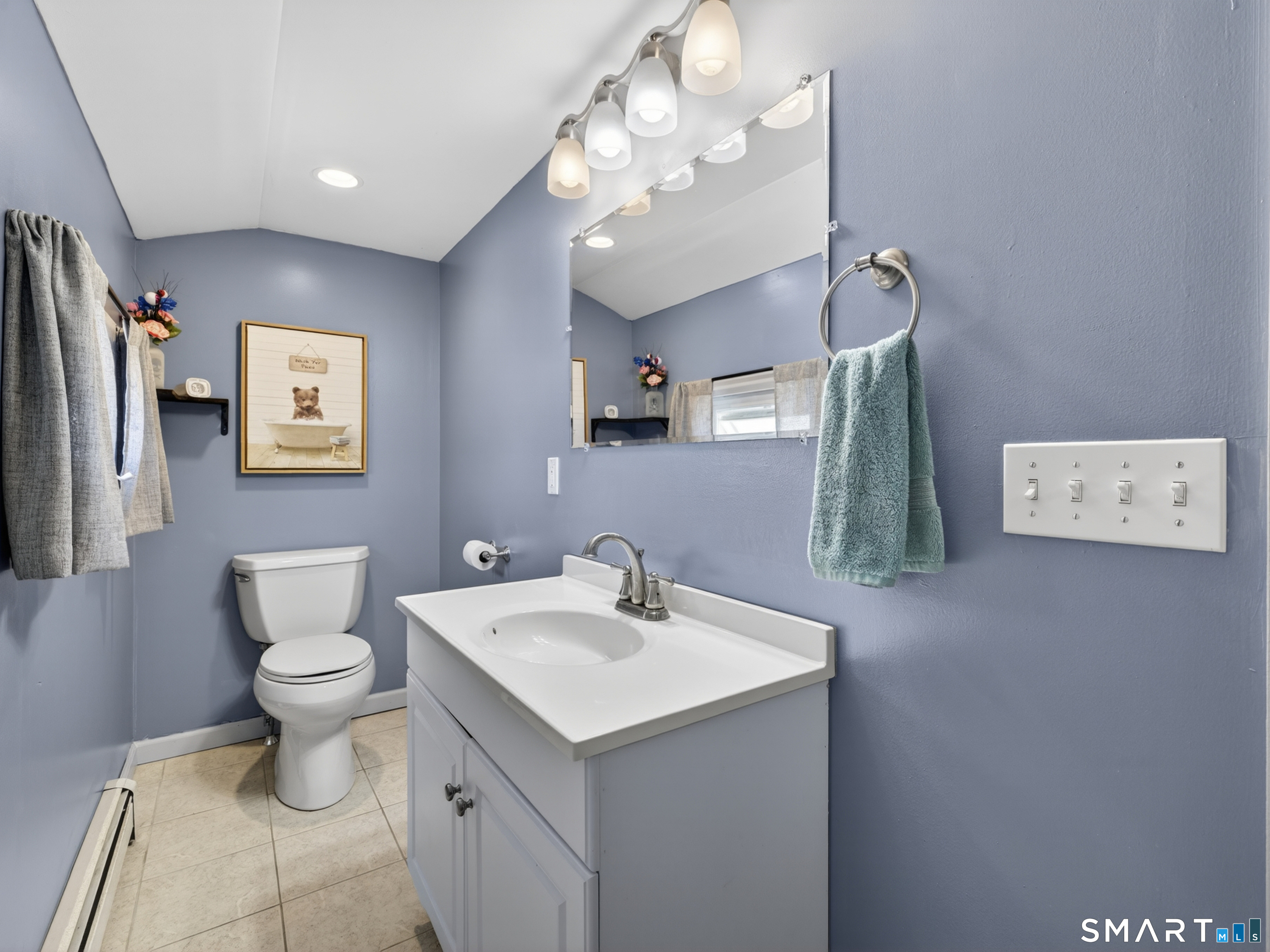 13 Oak Street Groton, CT 06340 - Photo 24 of 38 a bathroom with a toilet sink and mirror
