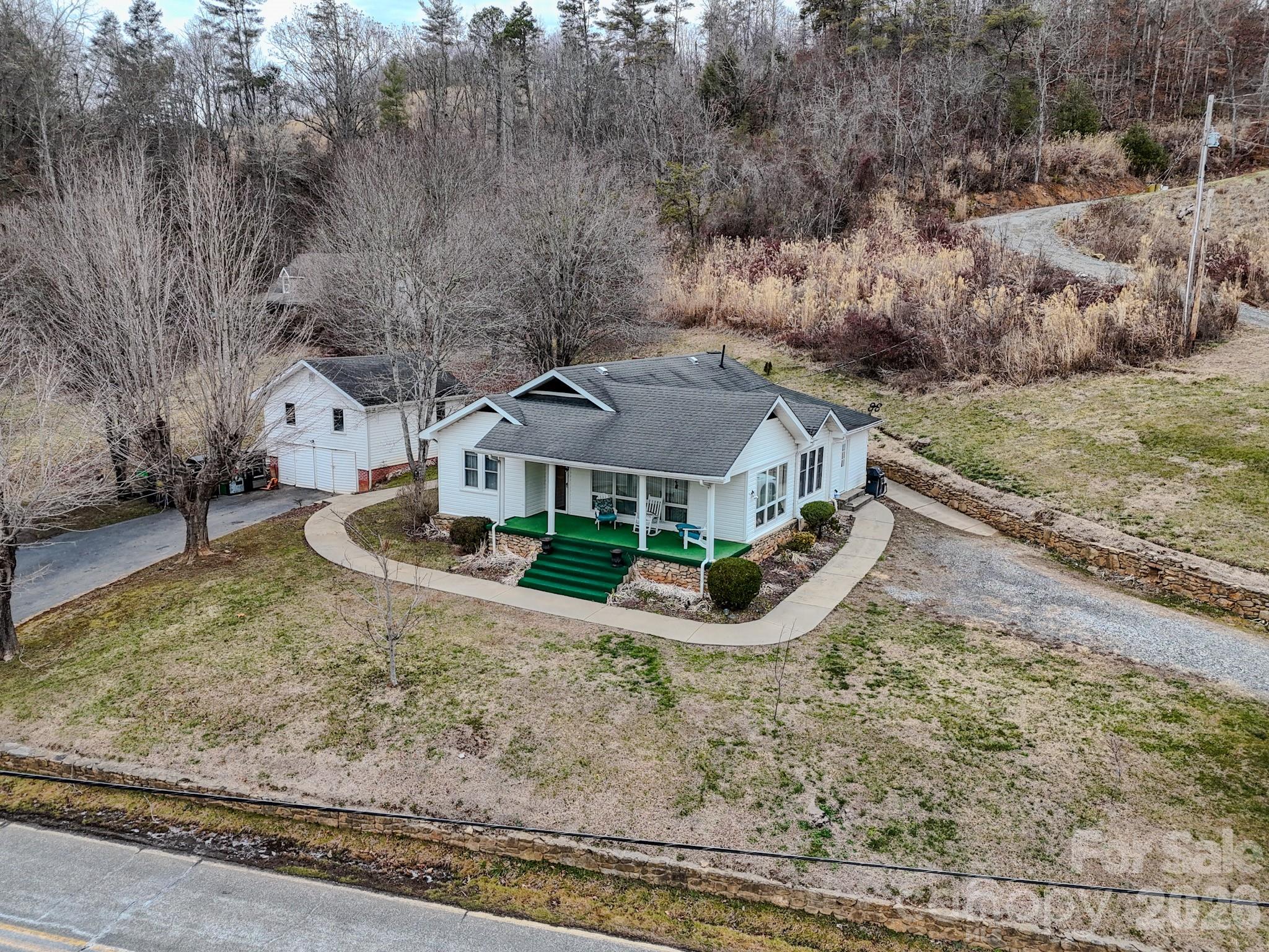 a view of a house with a yard