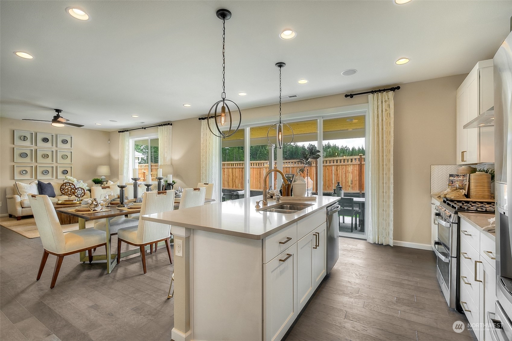 10304 Balto Road Northwest, Unit 37 Silverdale, WA 98383 - Photo 11 of 21 a kitchen with stainless steel appliances granite countertop sink stove and wooden floor