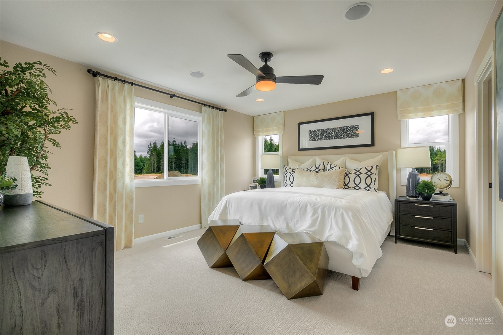 10304 Balto Road Northwest, Unit 37 Silverdale, WA 98383 - Photo 15 of 21 a bed sitting in a spacious bedroom next to a window