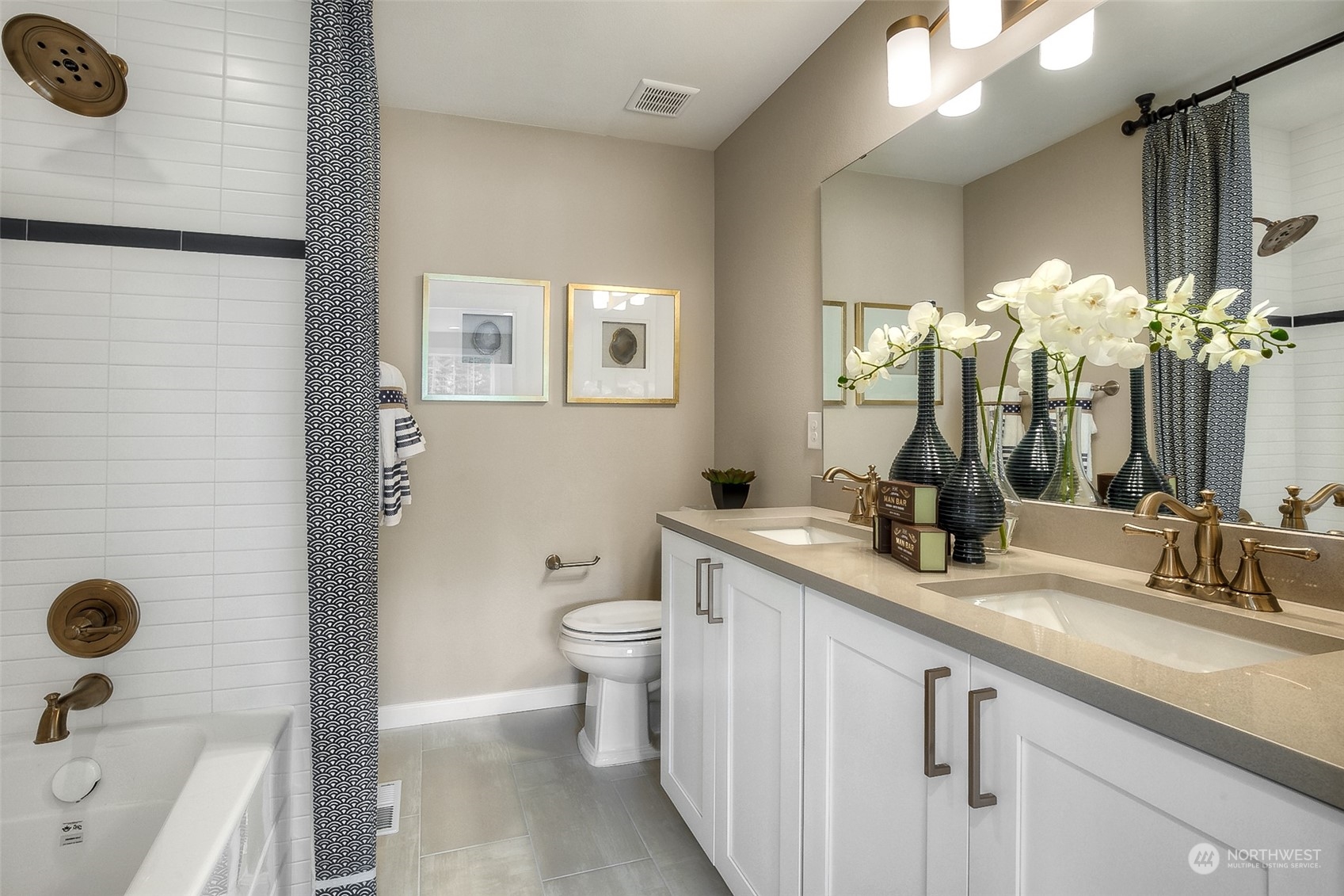 10304 Balto Road Northwest, Unit 37 Silverdale, WA 98383 - Photo 18 of 21 a bathroom with a sink a toilet and a mirror