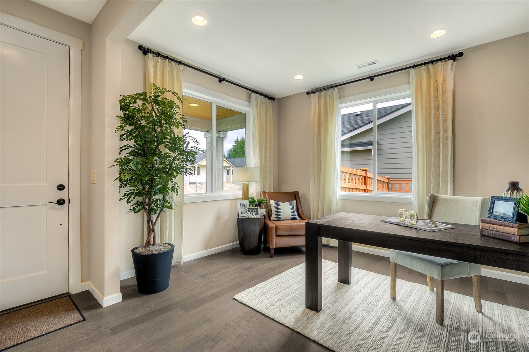 10304 Balto Road Northwest, Unit 37 Silverdale, WA 98383 - Photo 5 of 21 a room with view of potted plants and wooden floor
