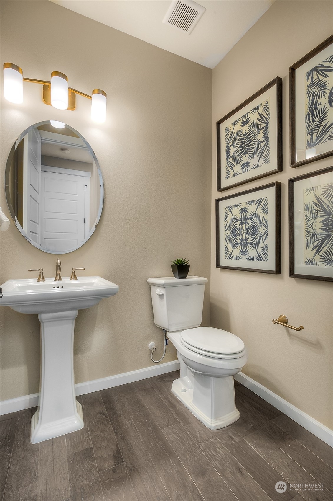10304 Balto Road Northwest, Unit 37 Silverdale, WA 98383 - Photo 6 of 21 a bathroom with a toilet a sink and mirror