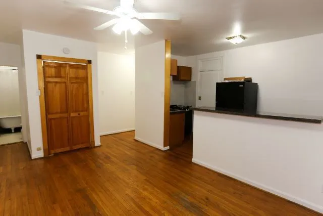 a view of a livingroom with wooden floor