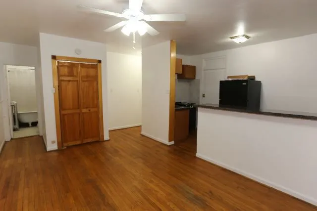 a view of a livingroom with wooden floor