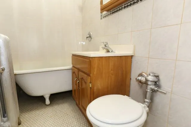 a bathroom with a sink a toilet and bathtub